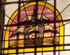 Geese in flight in stained glass